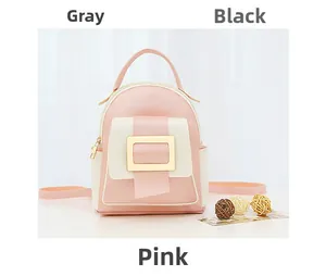 Detail of pink and white two-tone mini backpack with gold buckle and top handle