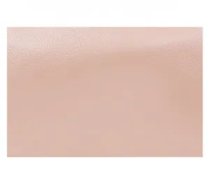 Detail shot of light pink PU leather texture with high wrinkle resistance and soft finish