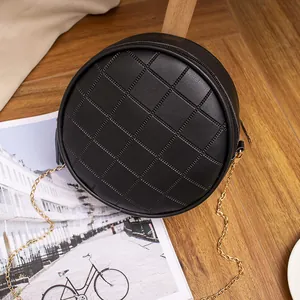 Black round quilted PU leather crossbody bag with elegant gold chain strap detail