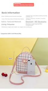 Pink plaid backpack detail showing 22x7x19cm size and pearl cat charm accessory