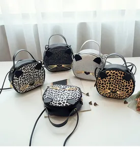 Variety of cat-shaped leopard print and glitter crossbody bags with metallic whiskers