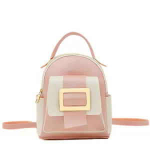 Mini color-block backpack in pink and beige with a large decorative gold square buckle