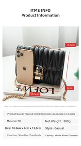 Close-up of black pleated faux leather bag with gold chain strap and detailed metal lock