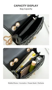 Internal capacity of black quilted chain bag showing main pocket and zipper pocket
