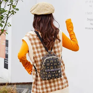 Petit sac à dos marron pour femme avec imprimé vintage et poches zippées pratiques