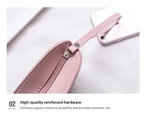 Dettaglio dell'hardware rinforzato e della cerniera scorrevole della borsa rosa