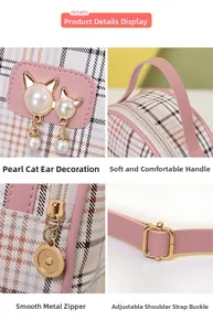 Detail view of pink leather handle and pearl cat-ear ornament on plaid bag
