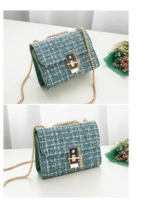 Detail of tweed crossbody bag featuring green weave pattern and gold chain strap