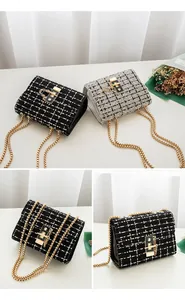 Detail of tweed woven crossbody bags with gold locks and bead chain straps