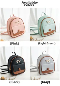 Vista detallada de mini mochilas en cuatro colores con lazo dorado y bordes en contraste