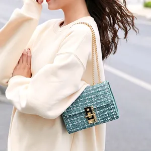 Women's tweed crossbody bag with turquoise weave texture and gold chain strap lock