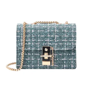 Women's plaid tweed flap bag with gold chain strap and elegant metal buckle