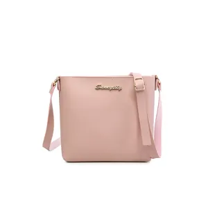 Pink minimalist faux leather crossbody bag for women with golden Sunnaycity logo detail