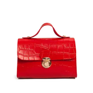 Elegant red crocodile embossed leather handbag with gold twist lock and top handle