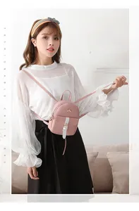 Pink mini PU leather backpack for women with golden bow and contrast strap detail