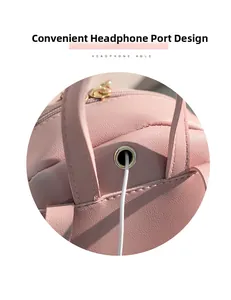 Detailed view of the pink leather backpack featuring a convenient metal headphone hole