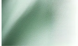 Detail of green litchi texture leather showing waterproof and wear-resistant features