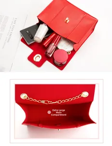 Detailed view of the oversized main compartment in a red crocodile-pattern chain bag