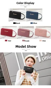 Detail view of colorful lychee pattern PU leather clutch bags with secure wrist straps