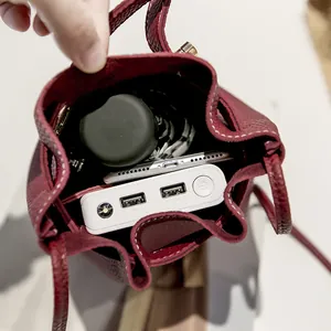 Burgundy lychee grain leather bucket bag with spacious interior for daily essentials