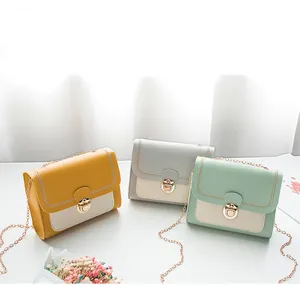 Detailed close-up of colorful mini crossbody bags with gold buckles and chain straps