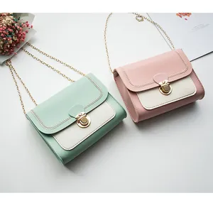 Detail of wave stitching and gold lock on mint green and pink chain bags