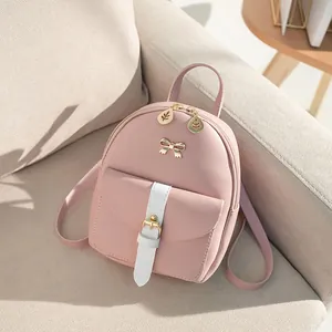 Mini pink and white contrast backpack in PU leather with gold bow and leaf zipper details