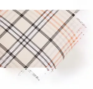 Detailed macro shot of plaid woven fabric texture with soft skin-friendly properties