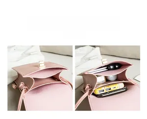 Detail showing the internal double-layer accordion compartments of this pink leather crossbody bag