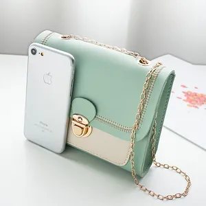 Chic mint green and off-white colorblock crossbody chain bag with stylish stitching detail