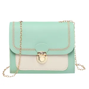 Mint green and beige small crossbody bag with gold chain and woven stitch details