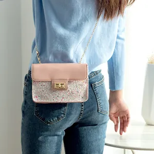 Women's iridescent sequin crossbody flap bag with golden chain strap and metal lock