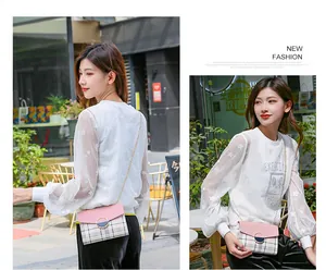 Outdoor shot of a pink checkered chain crossbody bag paired with a star pattern mesh top