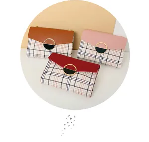 Close-up of contrast plaid crossbody bags with semi-circular gold metal buckle