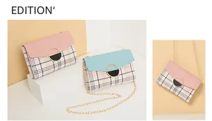 Detail of pink and blue plaid crossbody bags with golden chain and round lock