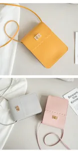 Detail of elegant lace edge crossbody bags with golden square locks in multiple colors