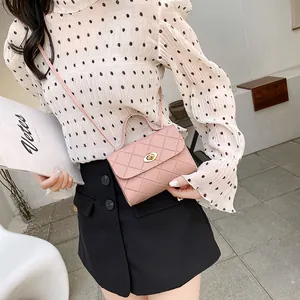 Pink quilted crossbody bag with golden oval clasp and elegant semi-circular handle