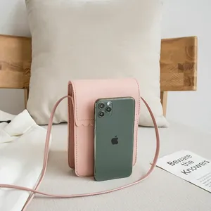 Pink lychee texture crossbody phone bag with scalloped flap and slim shoulder strap