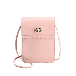 Pink faux leather crossbody phone bag with scalloped flap and golden metal twist lock