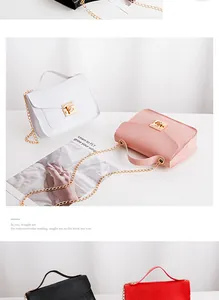 Detail showing assorted lizard embossed faux leather crossbody bags with gold chain straps