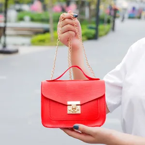 Red textured mini chain crossbody bag for women with gold lock and top handle
