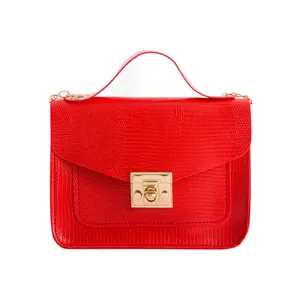 Lizard pattern bright red crossbody bag with golden hardware and top handle for women