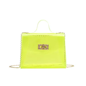 Neon yellow transparent PVC crossbody bag with golden chain strap and metal lock