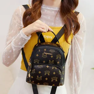Deep coffee mini monogram backpack with gold metal plaque and luxury patterns
