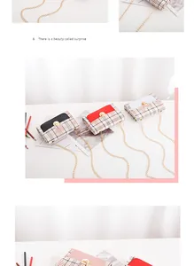 Detailed view of plaid crossbody bags in black, red, and white with gold chain straps