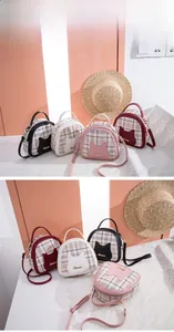 Detailed view of four plaid cylinder bags with cat ear design in black white pink and red