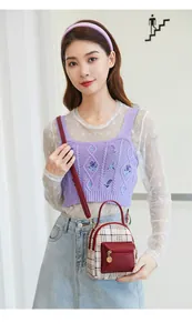 Mini plaid backpack shown as a crossbody bag on a model wearing casual knitwear