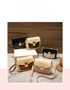 Detailed view of five crocodile pattern flap bags in various colors on marble display