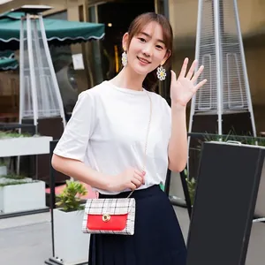 Women's red leather mini square crossbody bag with classic plaid pattern and chain strap