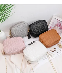 Various colors of quilted crossbody bags with chain straps and tassel details
